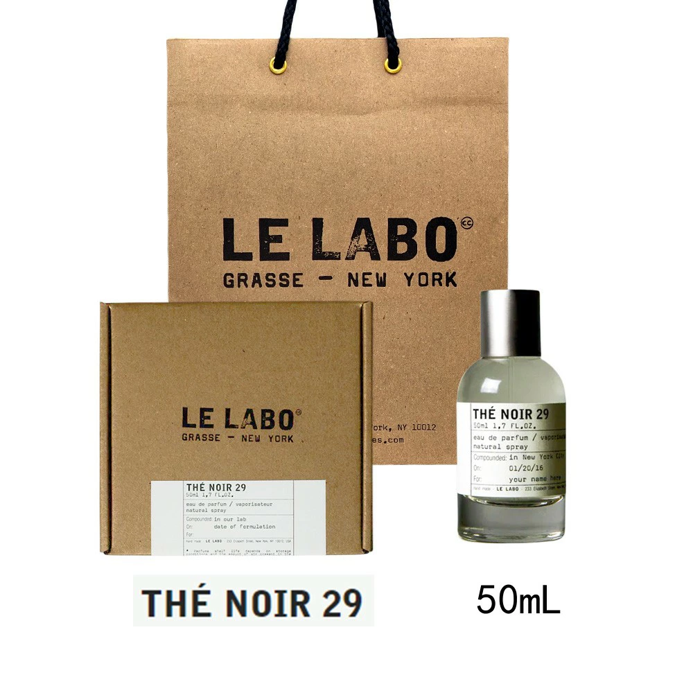 茶色の紙袋と箱にLE LABOのロゴ。透明な香水ボトル「THÉ NOIR 29」、容量50mLと記載あり。シンプルで洗練されたデザイン。